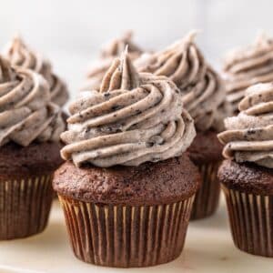 Oreo frosting over chocolate cupcakes.