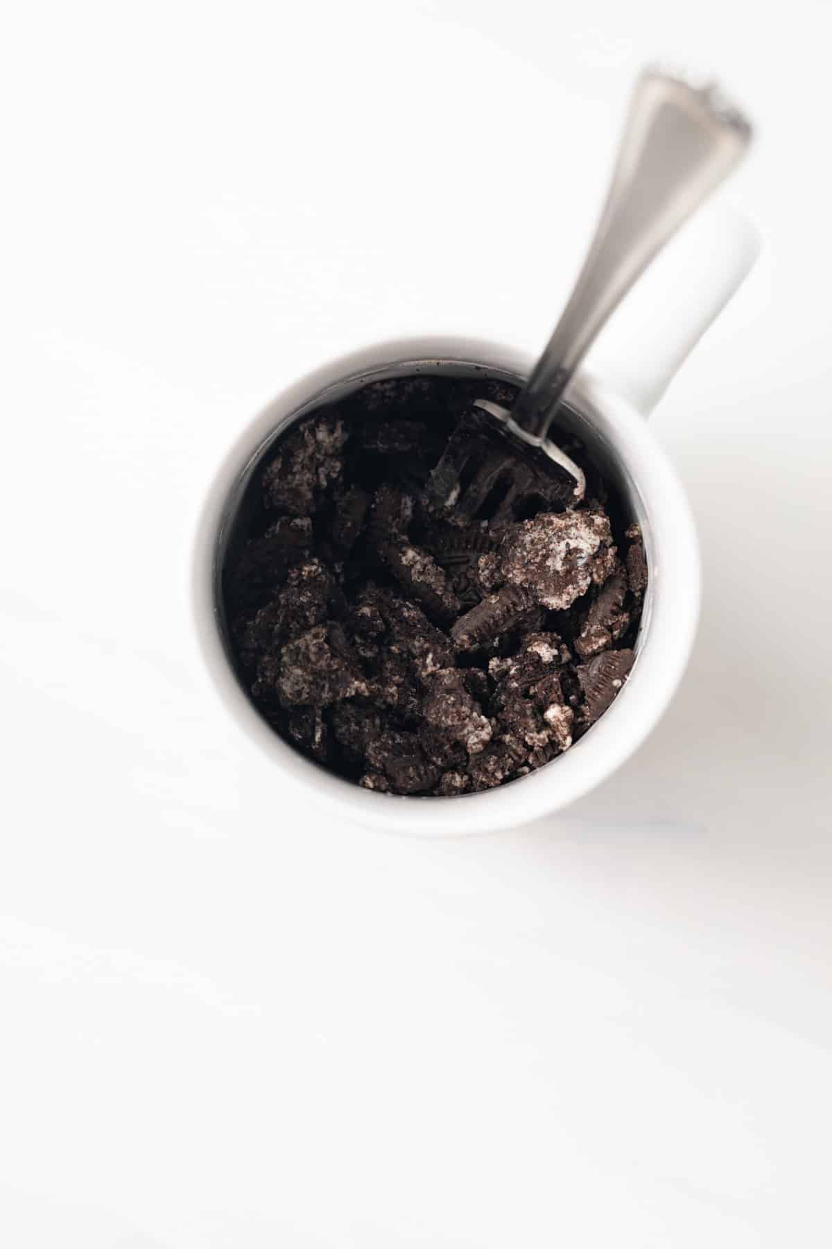Crushed Oreos in a mug.