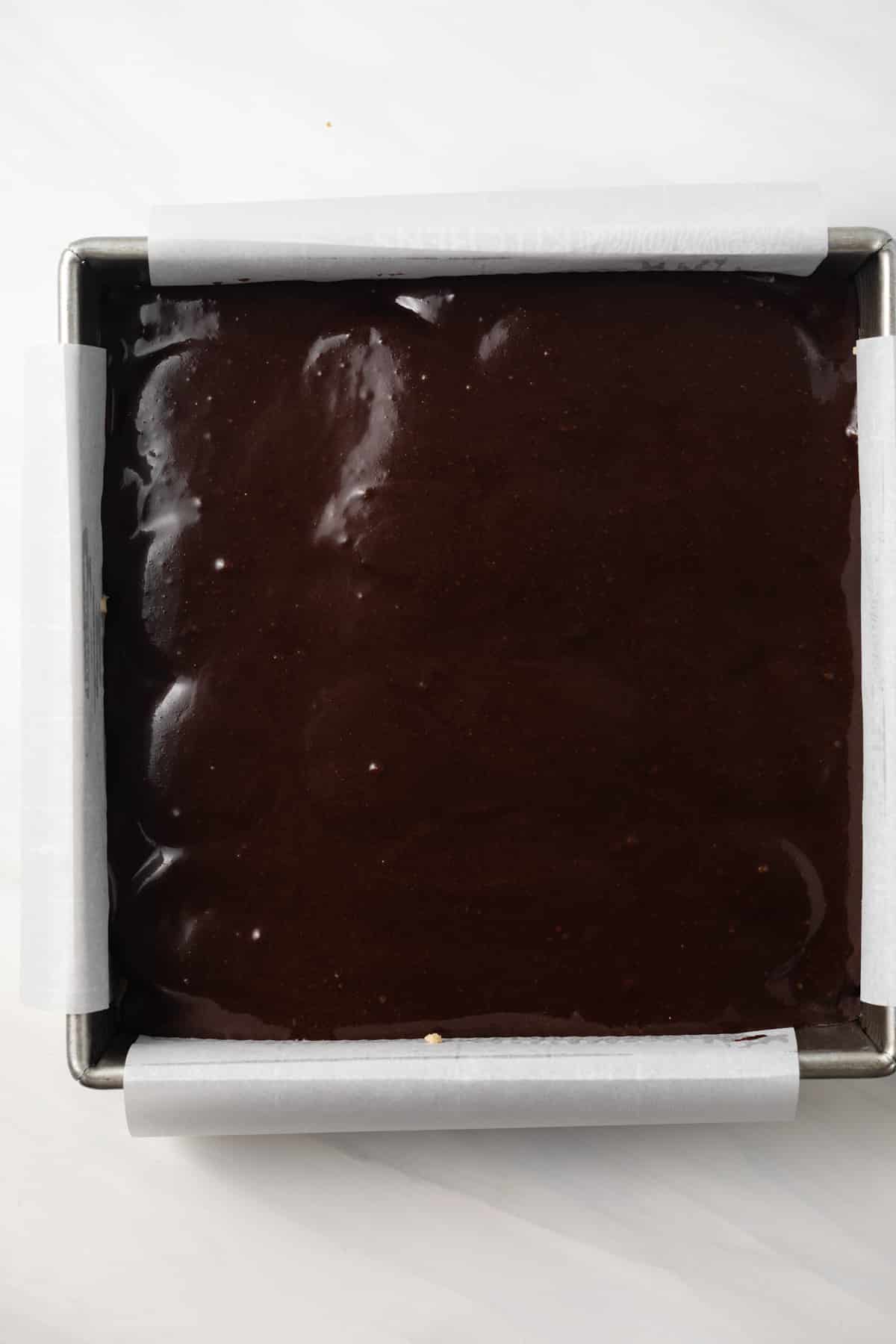 Unbaked Oreo stuffed brookies in baking pan.