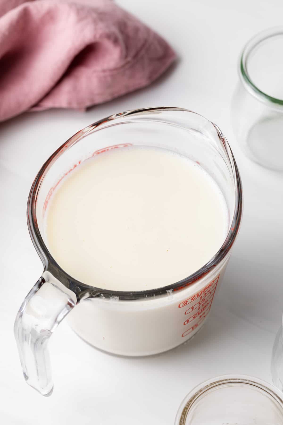 panna cotta custard in glass liquid measuring cup