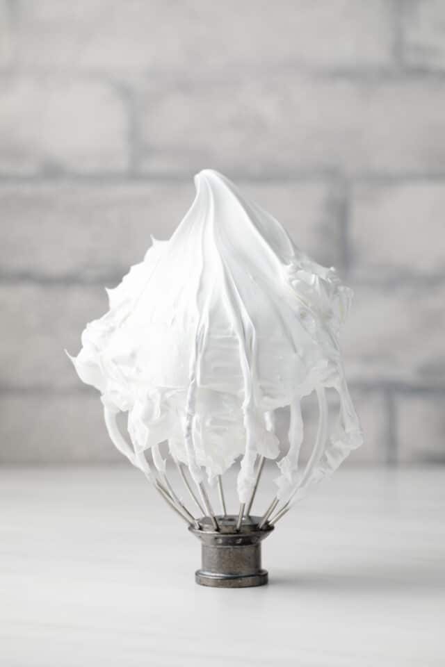 Whipped meringue on a whisk attachment.