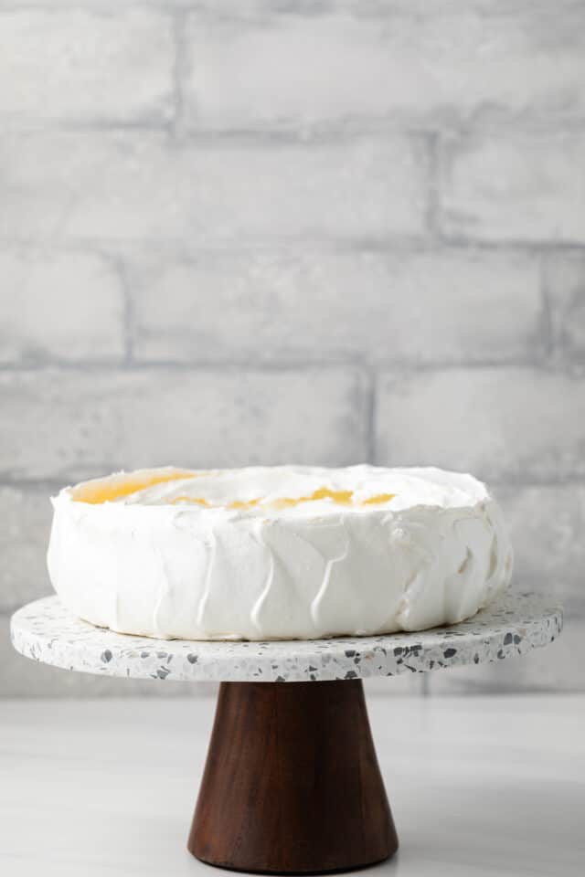 Baked pavlova on a cake stand.