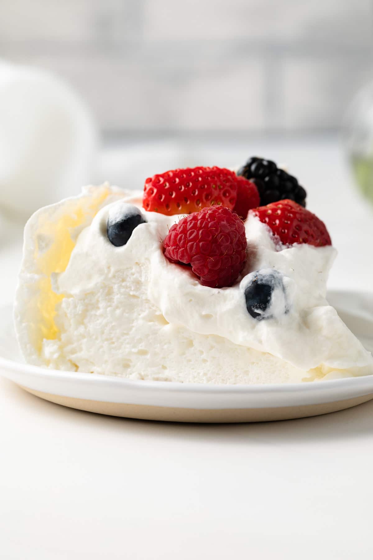 Slice of pavlova on plate.