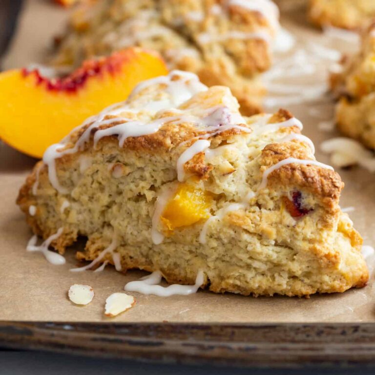 side view of peach scones on a baking sheet