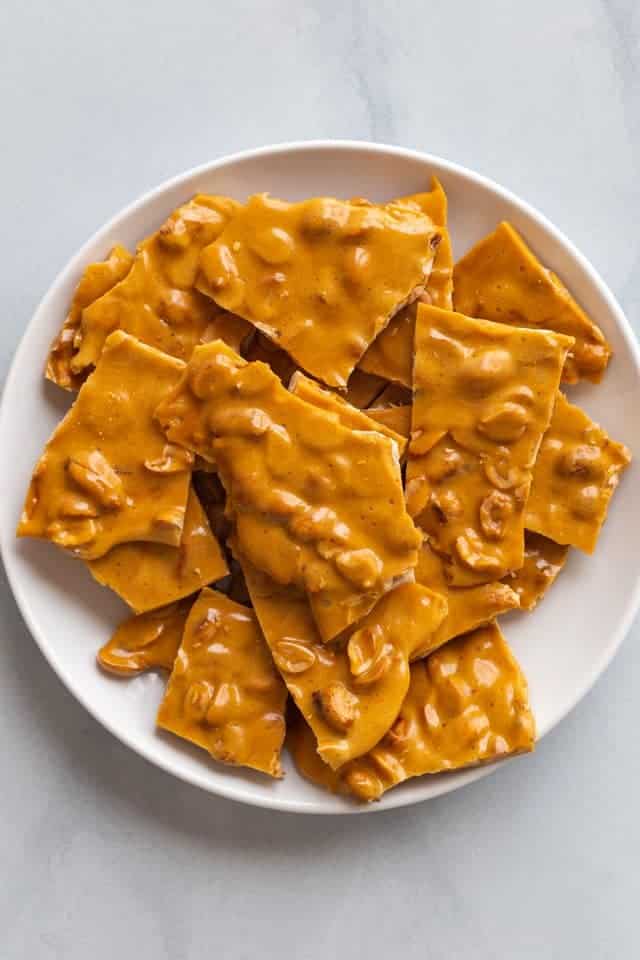 peanut brittle on white plate