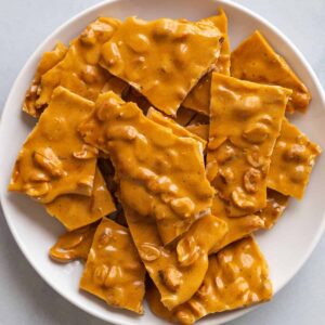 peanut brittle on white plate