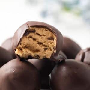 Peanut butter ball with bite taken out.