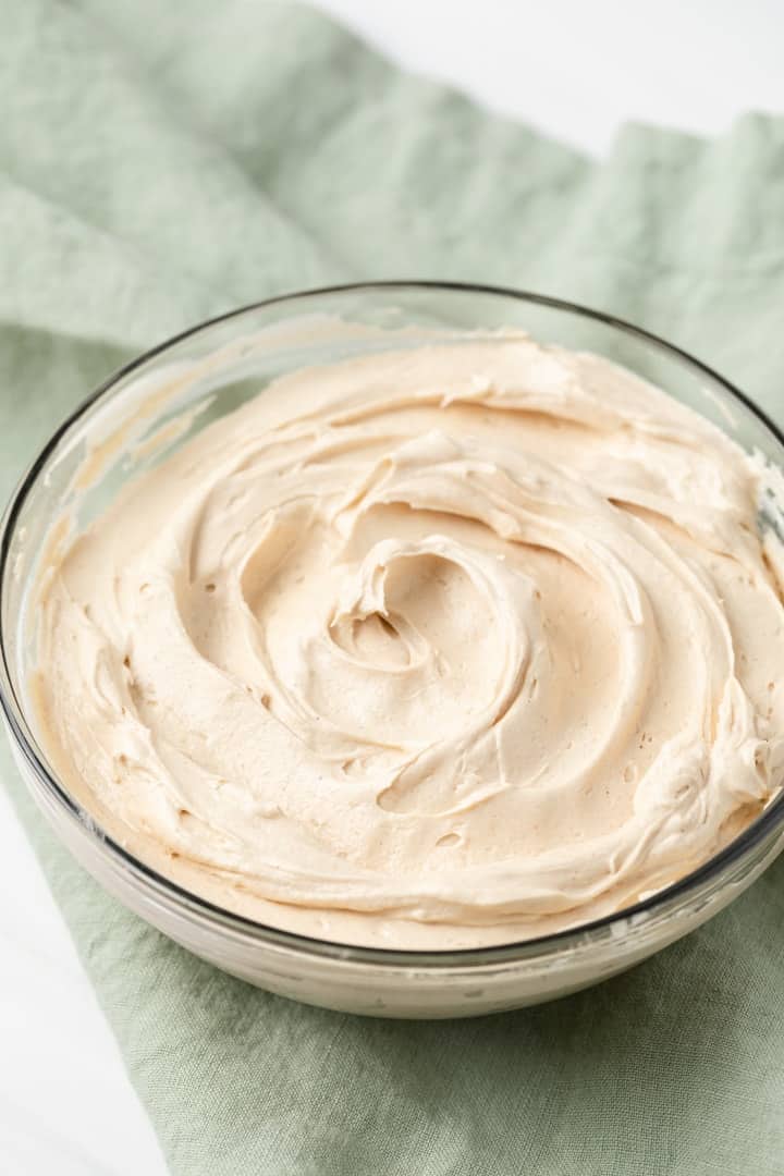 a bowl of creamy peanut butter buttercream