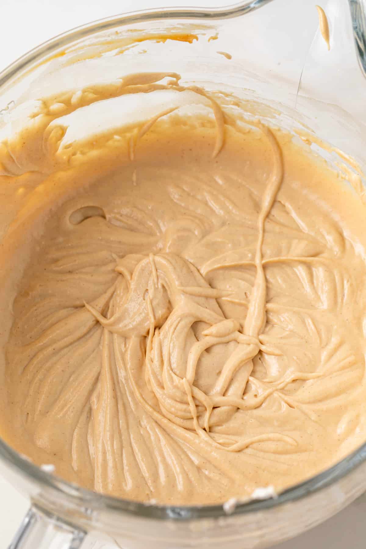 Peanut butter ice cream base in a glass bowl.