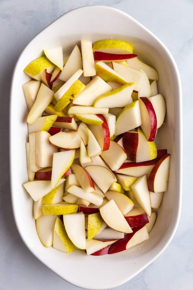 sliced pears in a white baking pan