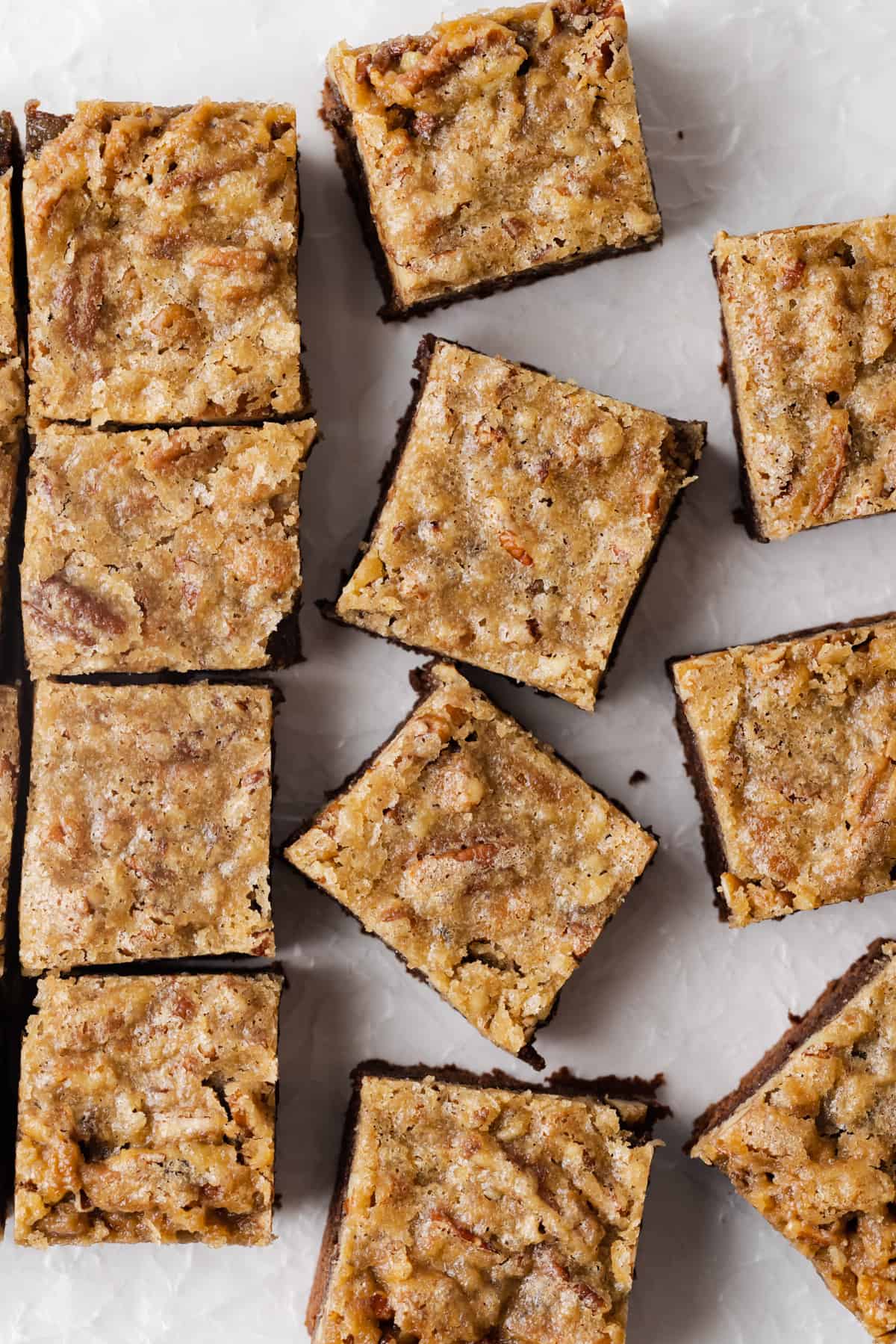 Candied pecan brownies on parchment paper