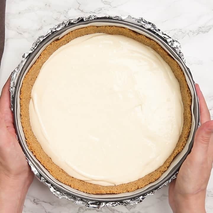 pecan pie cheesecake filling in a graham cracker crust