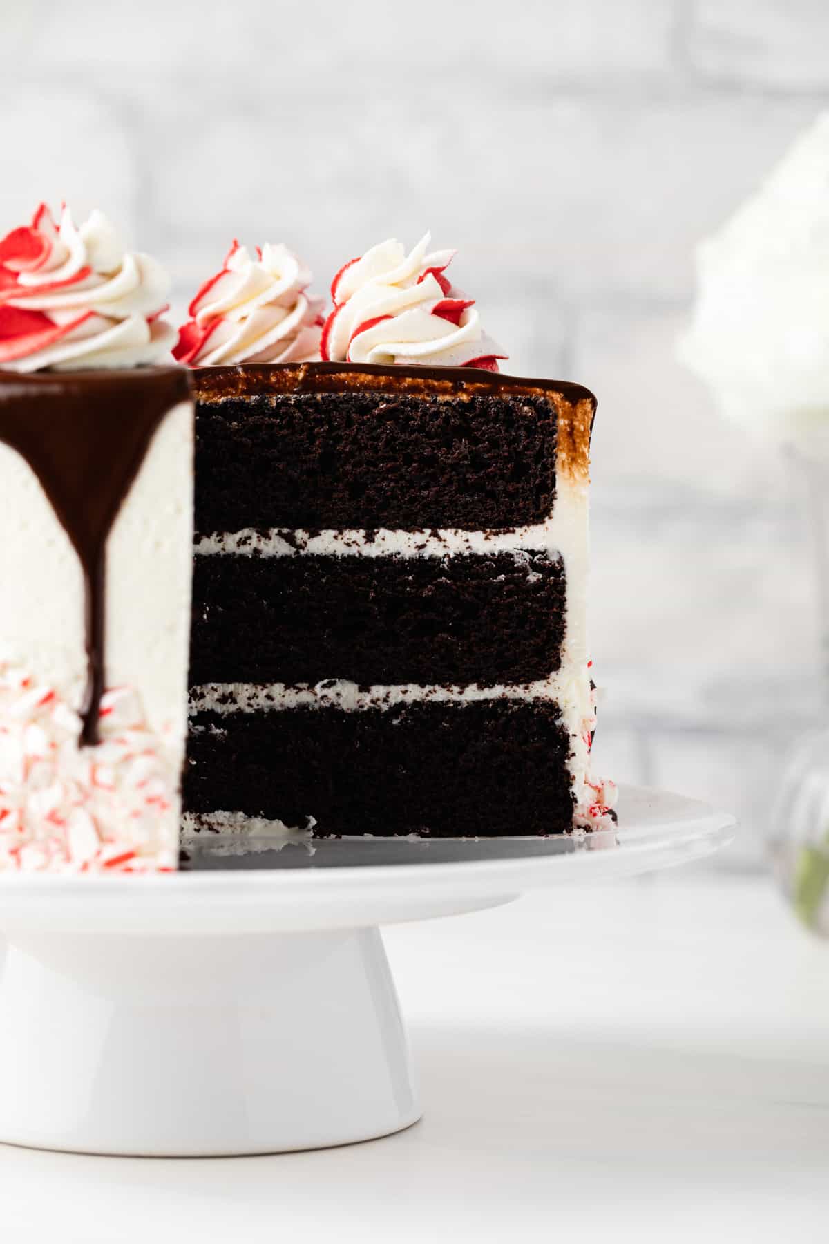 Peppermint fudge cake with slice taken out so layers are visible