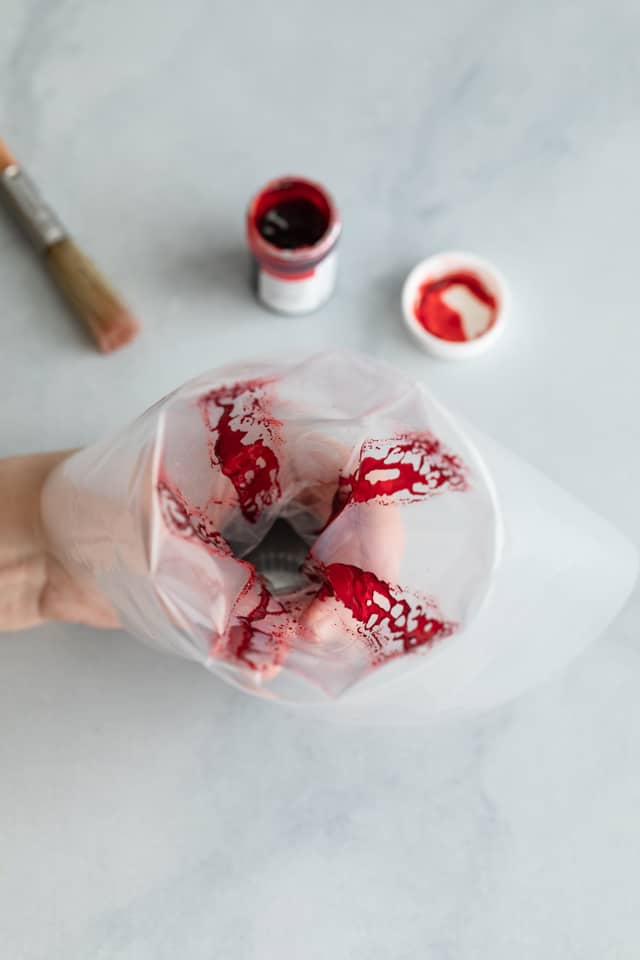 red food coloring painted inside piping bag