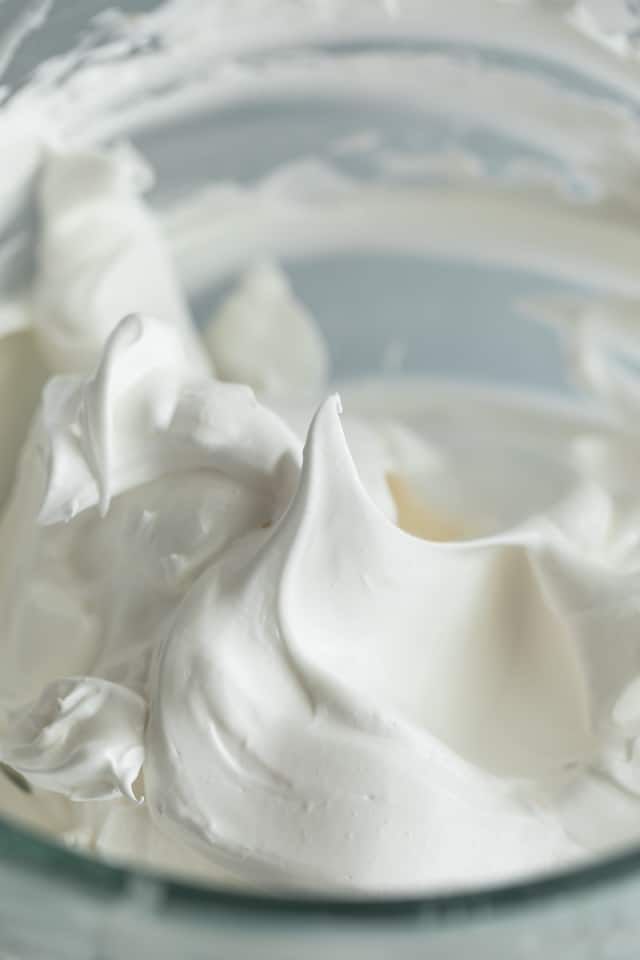 whipped eggs whites in glass bowl