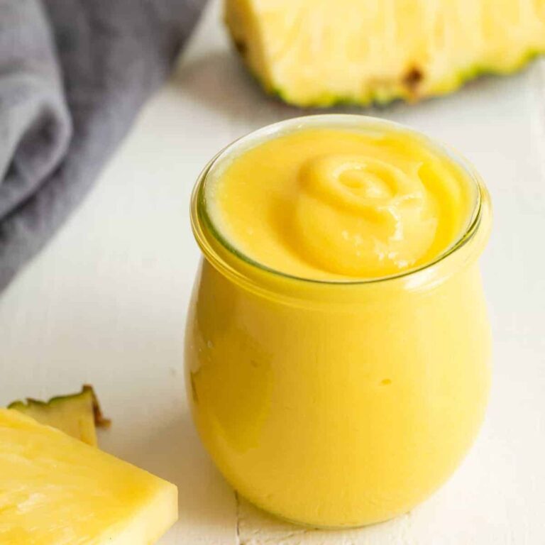Side view of pineapple curd in a jar