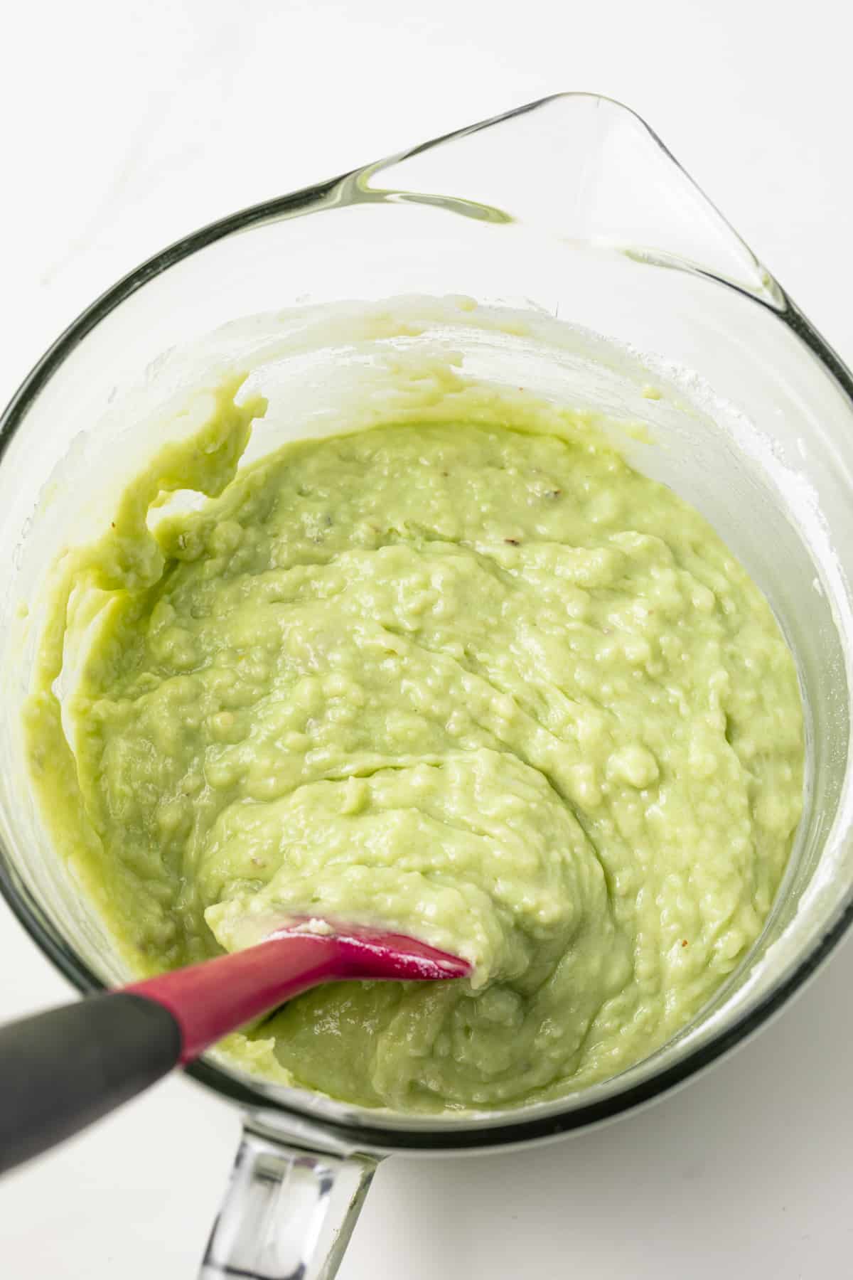 Muffin batter in a glass bowl.