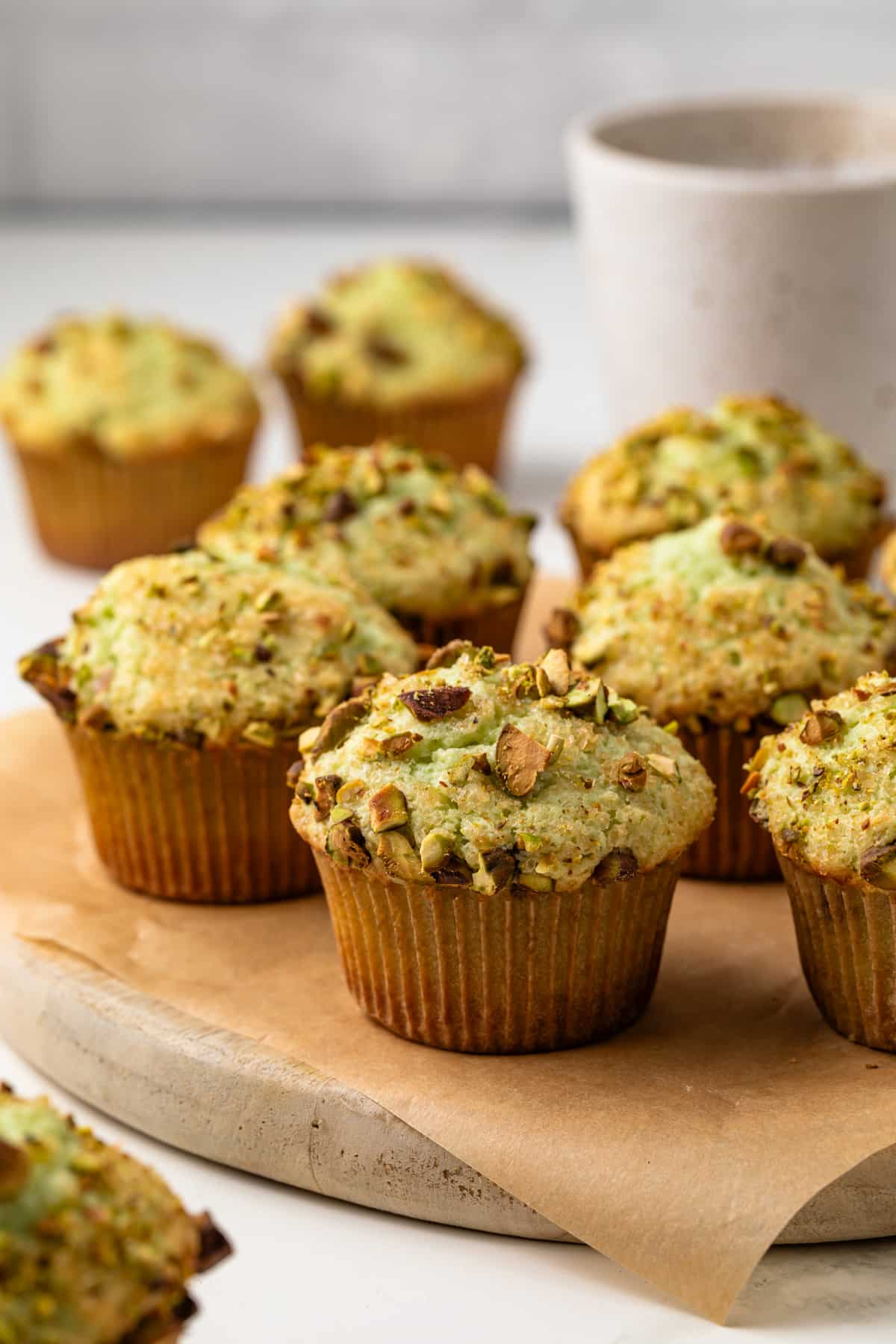 Pistachio pudding muffins on a serving platter.