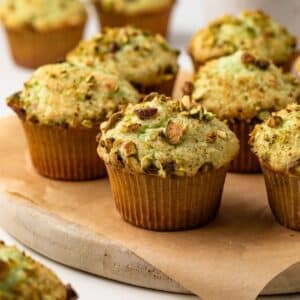 Pistachio pudding muffins on a serving platter.