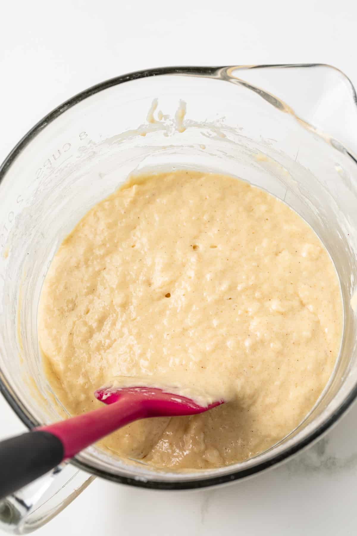 Donut batter in glass mixing bowl.