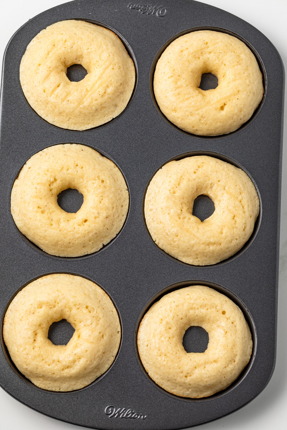 Baked donuts in donut pan.