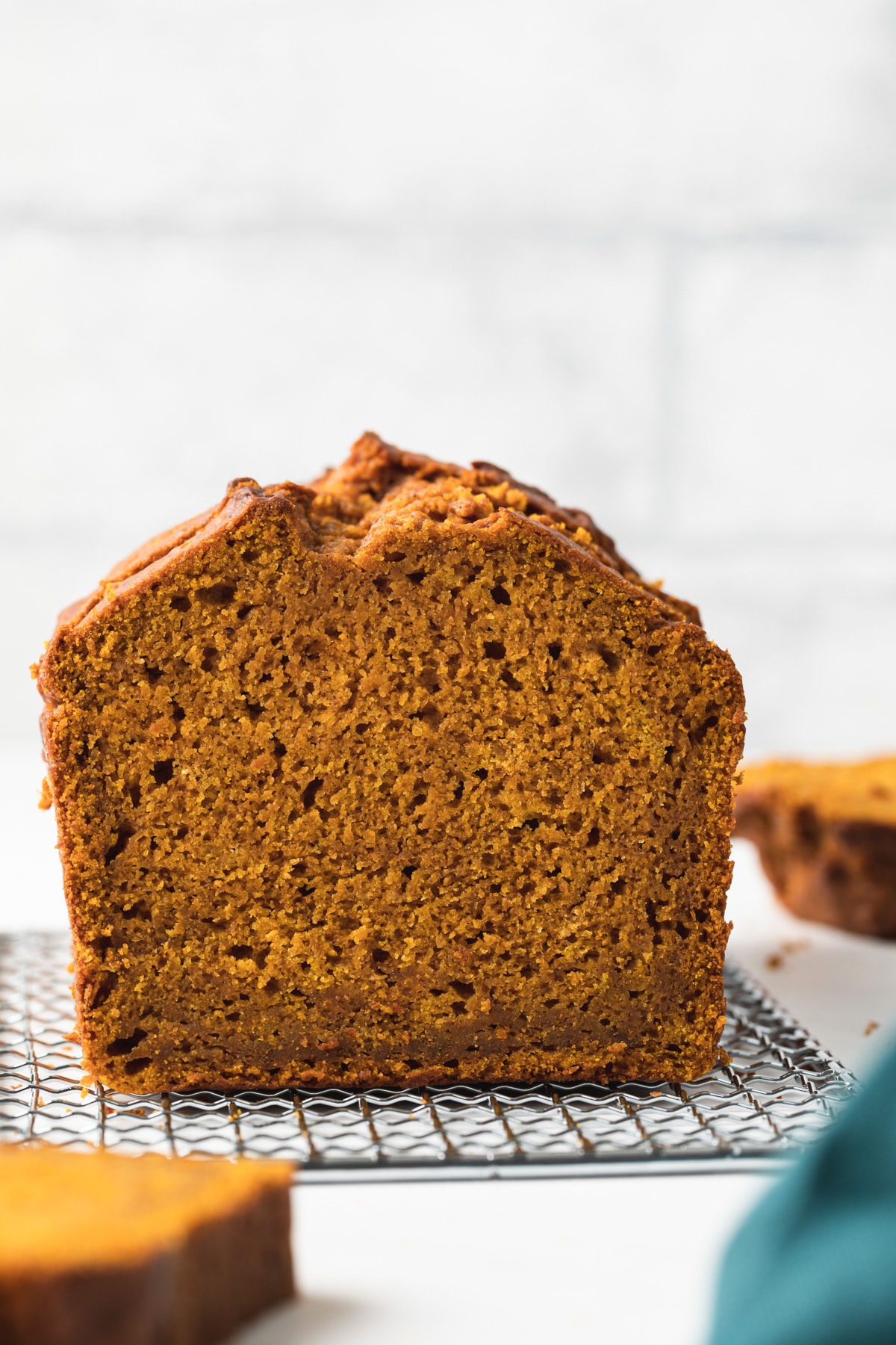 loaf of pumpkin bread with slice taken out so inside is visible