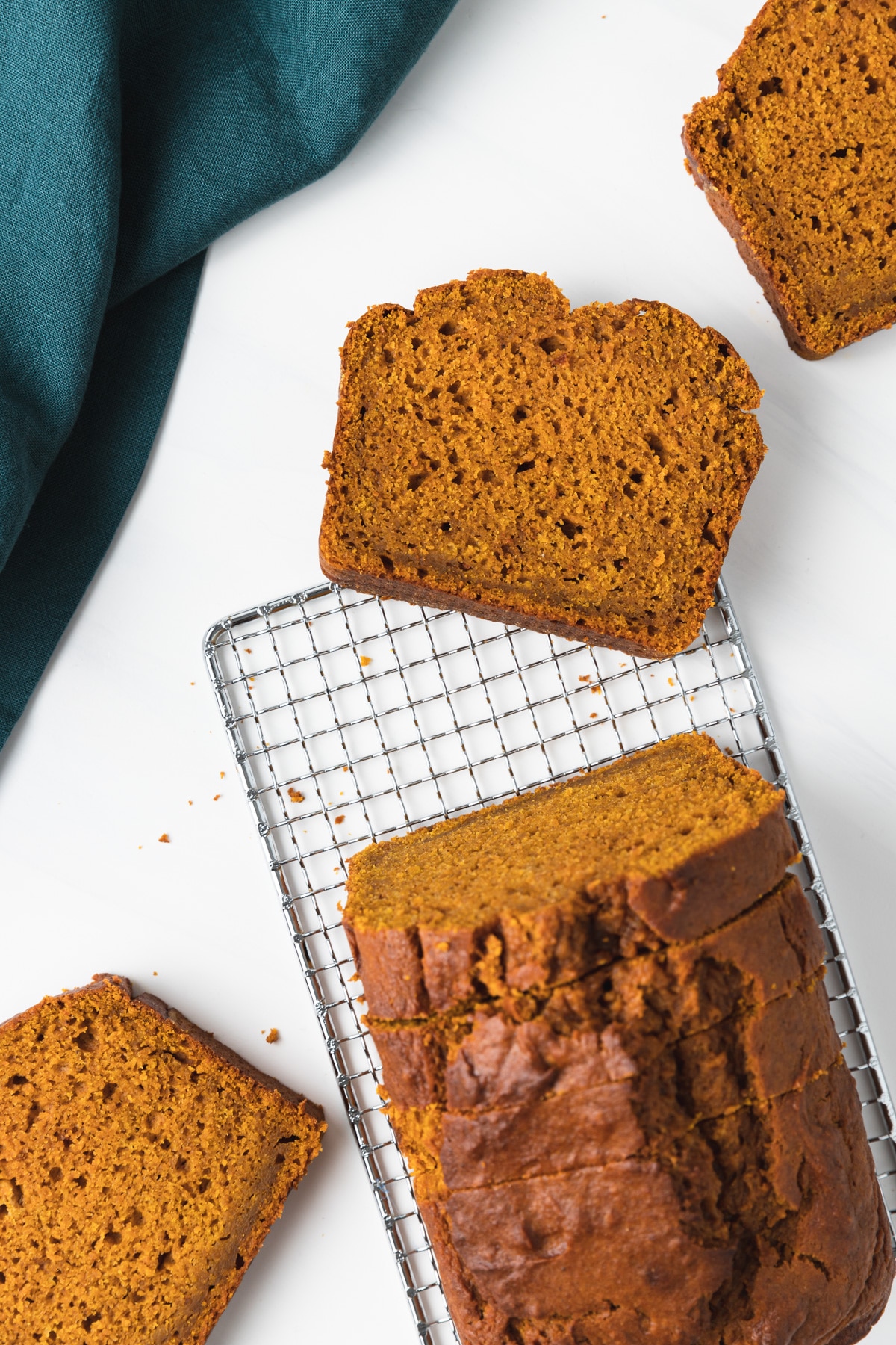 overhead of pumpkin bread with slices taken out