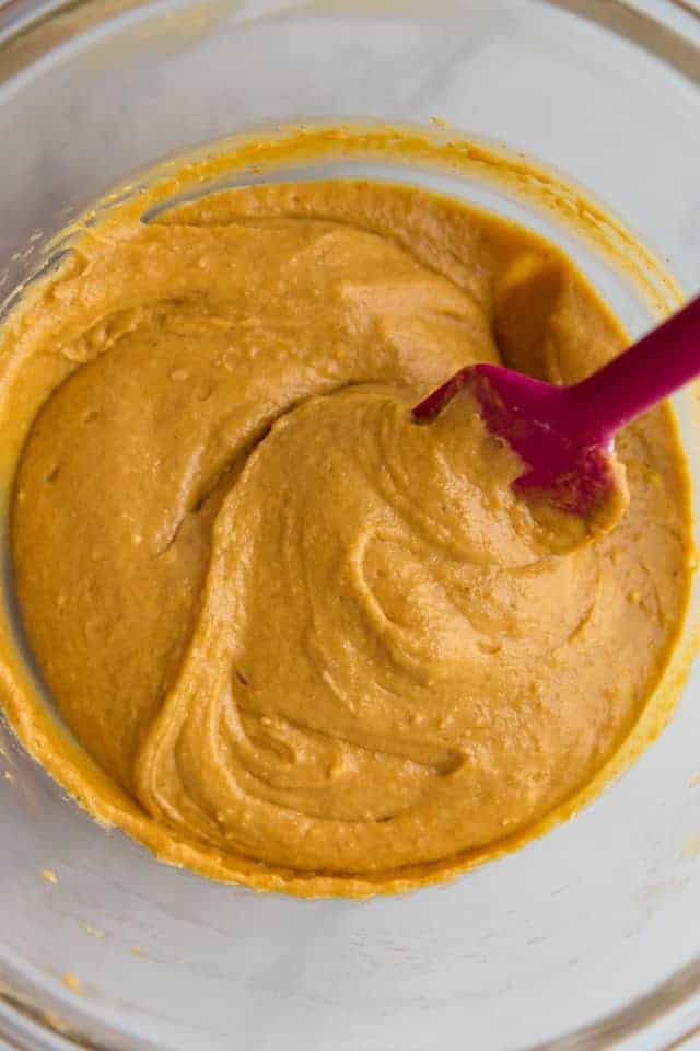overhead view of pumpkin muffin batter in a glass bowl