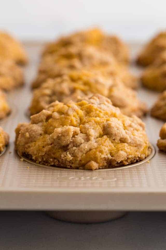 side view of pumpkin muffins in a baking pan