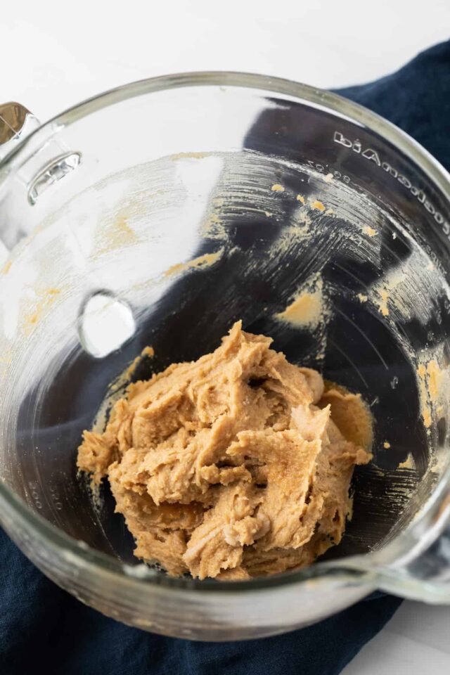 Creamed butter and sugar in glass bowl