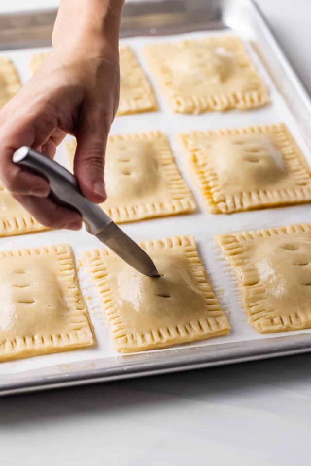 Slits being cut in the top of homemade pop tarts before baking