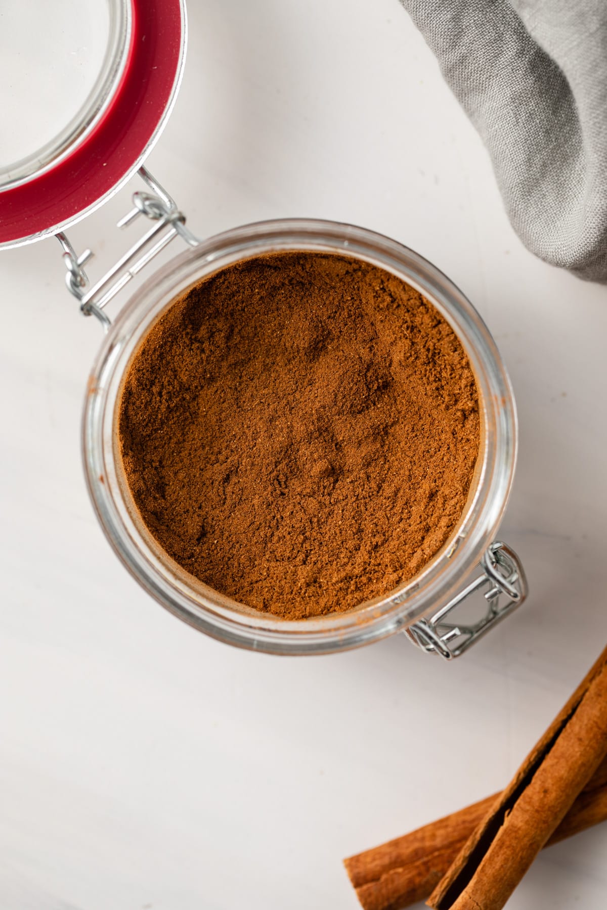 Homemade pumpkin pie spice in a glass jar.