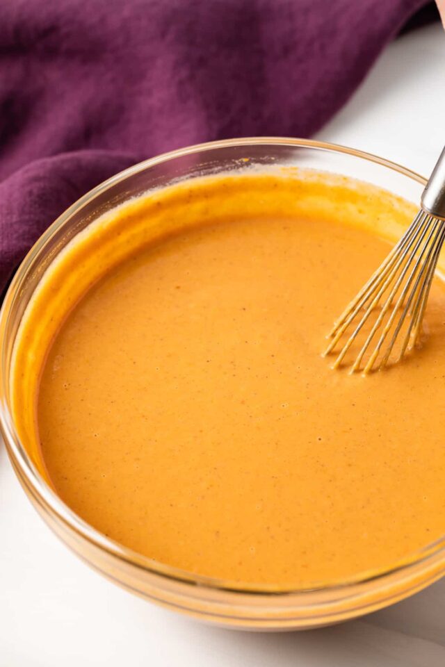 Pumpkin pie filling in a mixing bowl