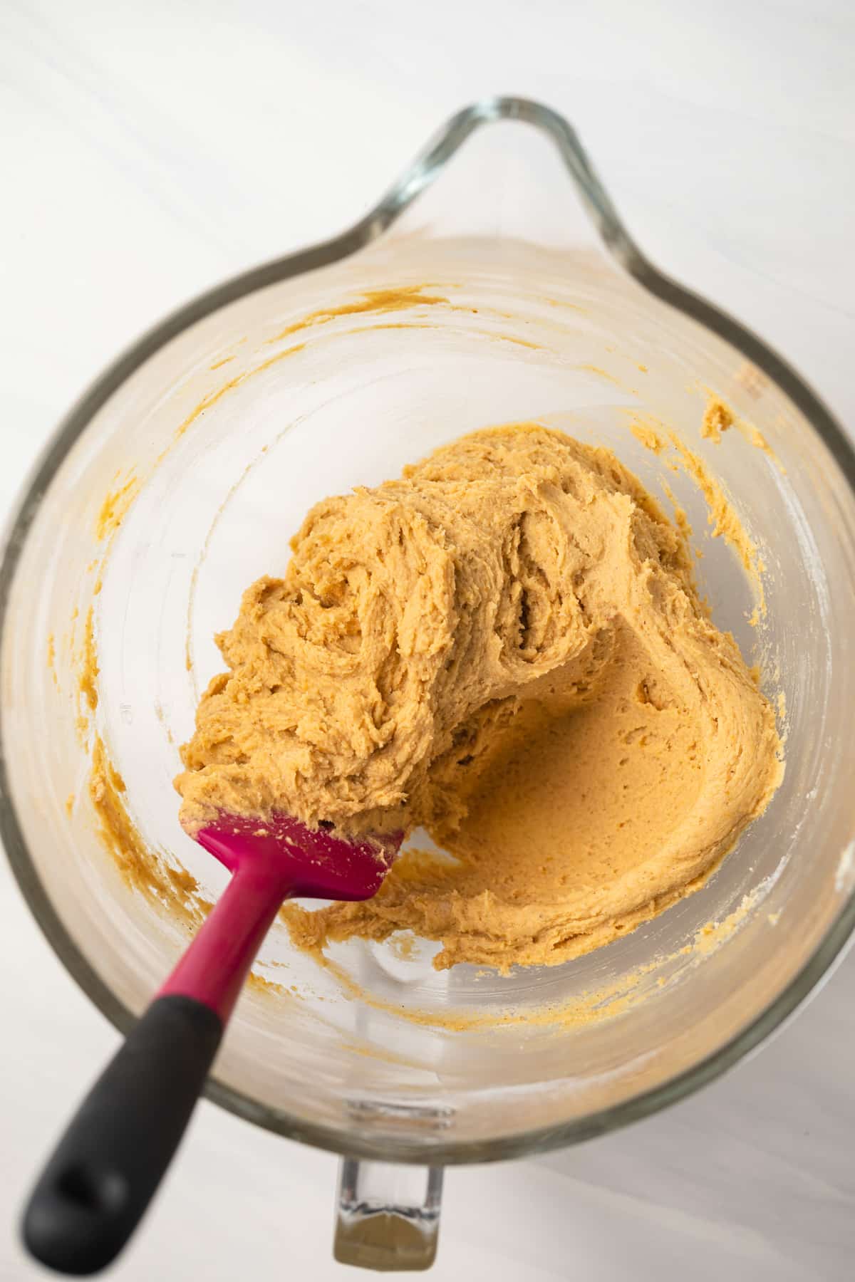 Pumpkin snickerdoodle cookie dough in glass bowl.
