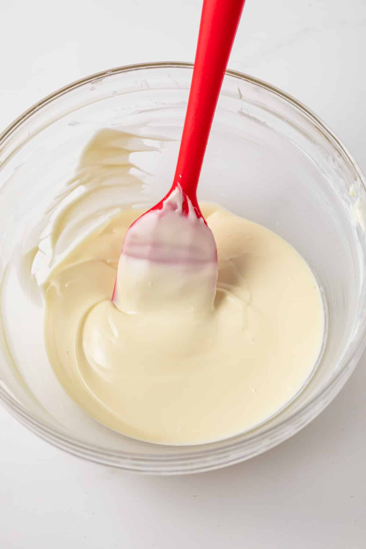 Melted white chocolate in glass bowls.