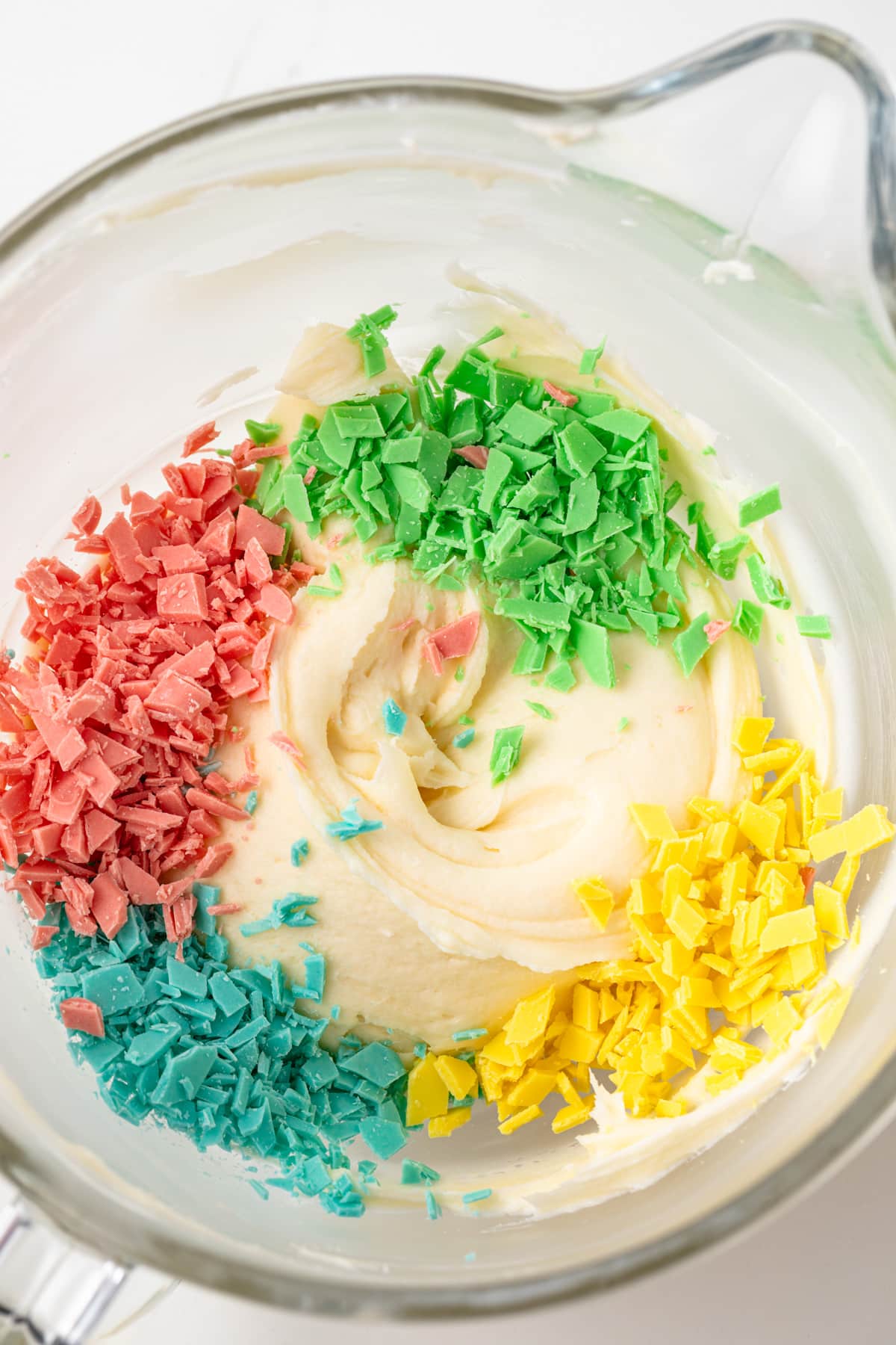 Frosting with homemade rainbow chips.