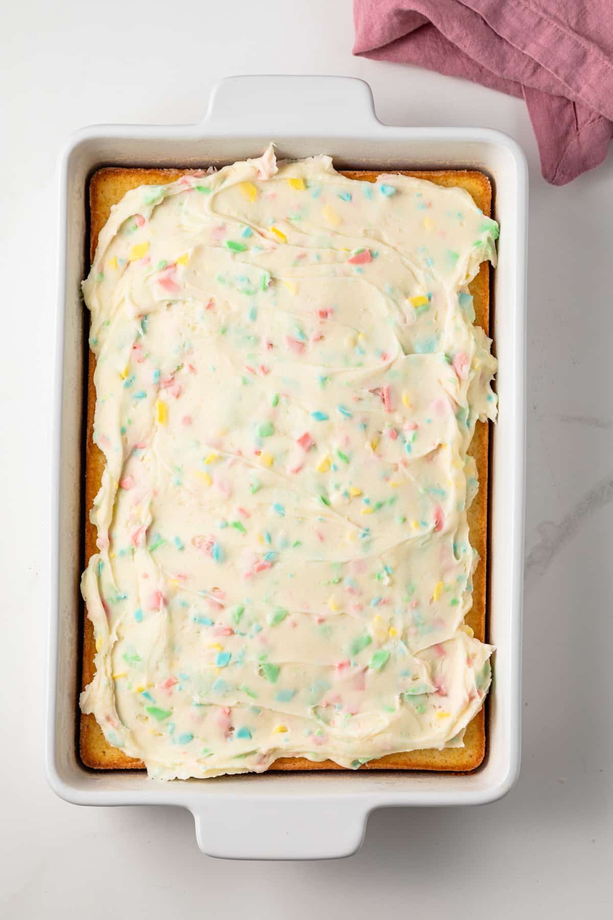 Rainbow chip frosting on sheet cake.