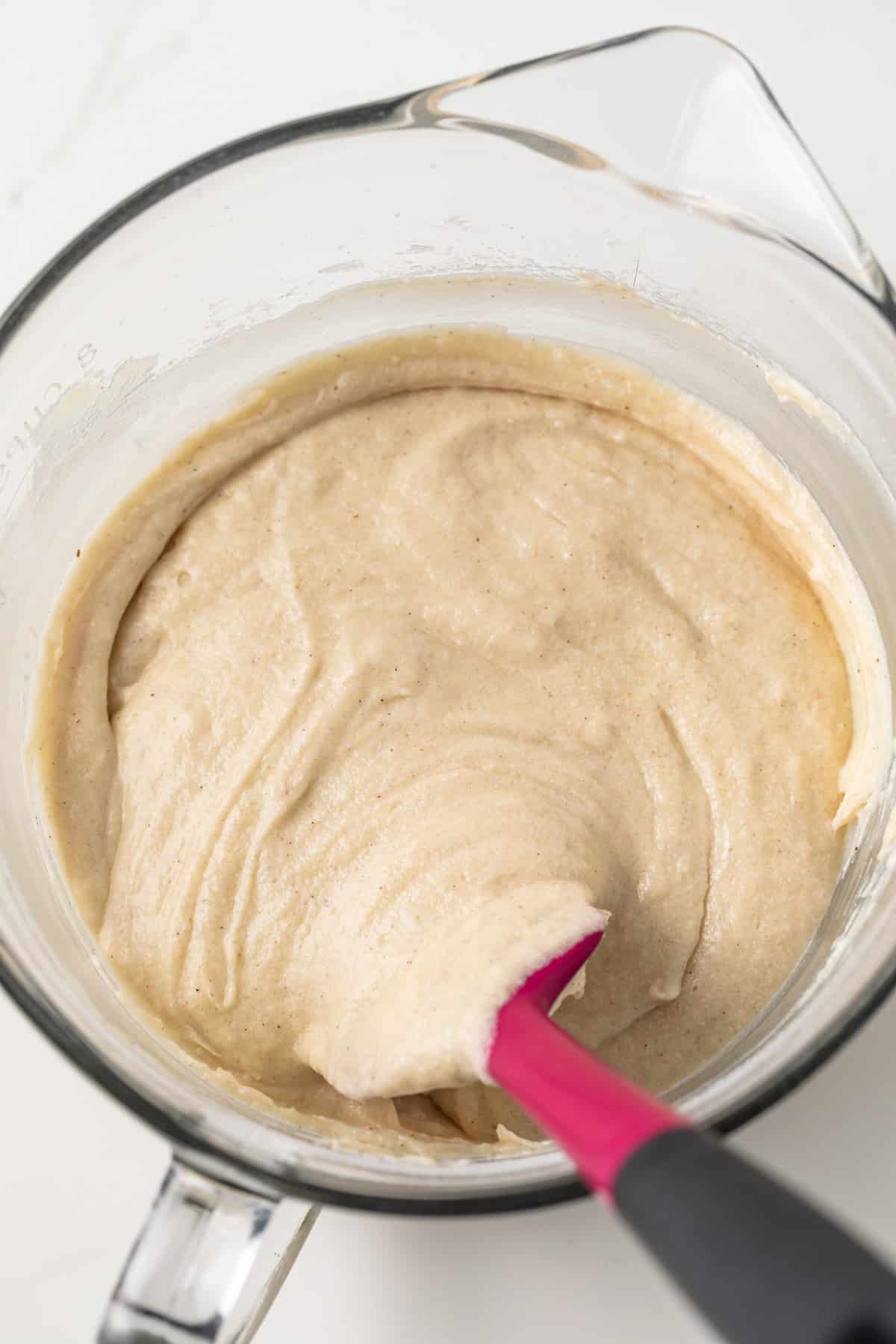 Coffee cake batter in glass mixing bowl.