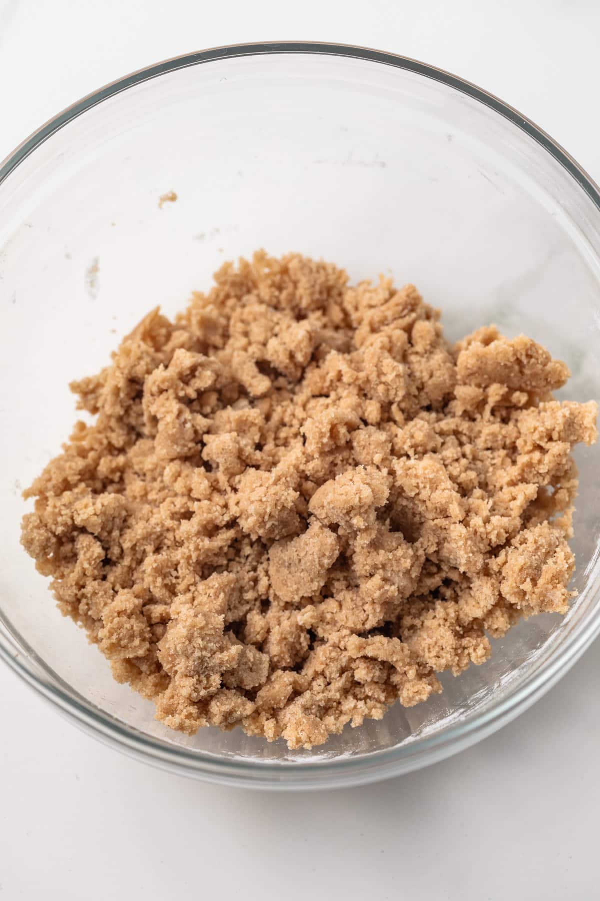 Crumb topping a glass bowl.