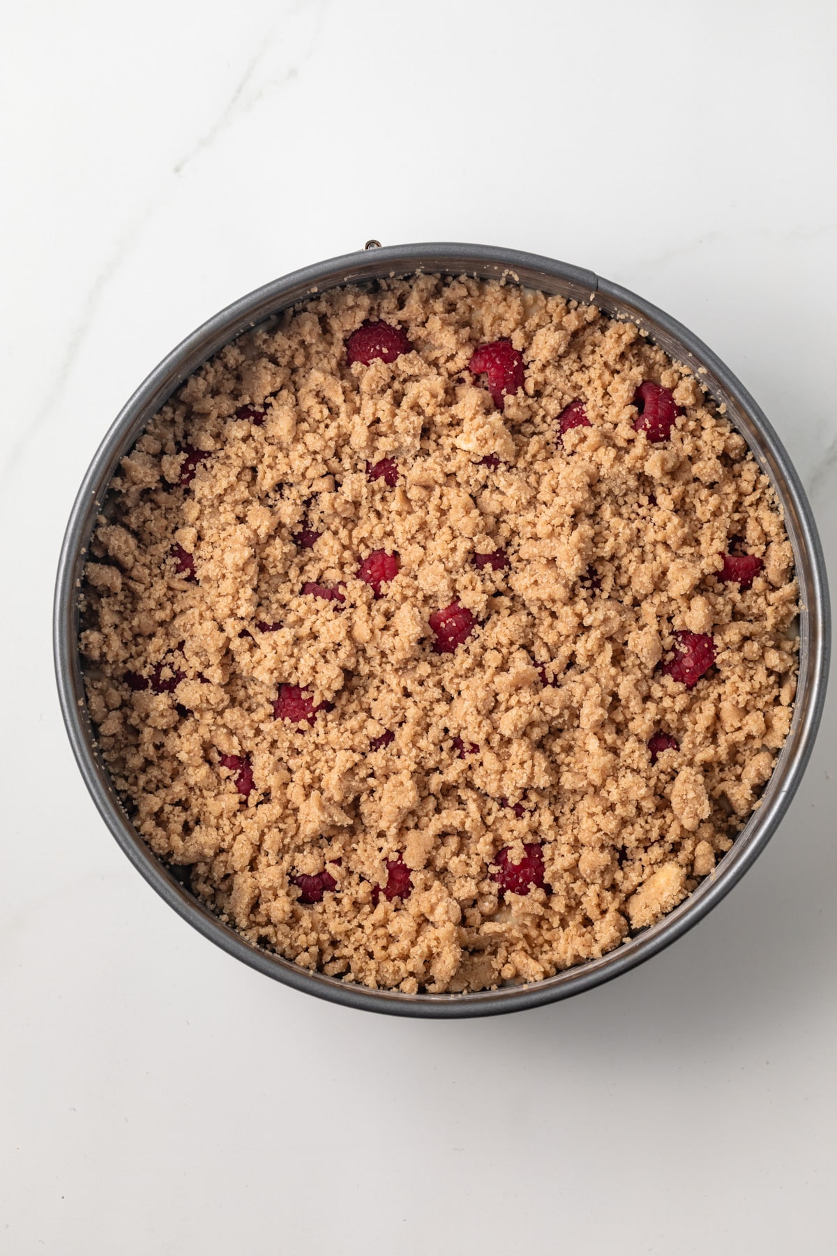 Overhead of unbaked coffee cake in pan.
