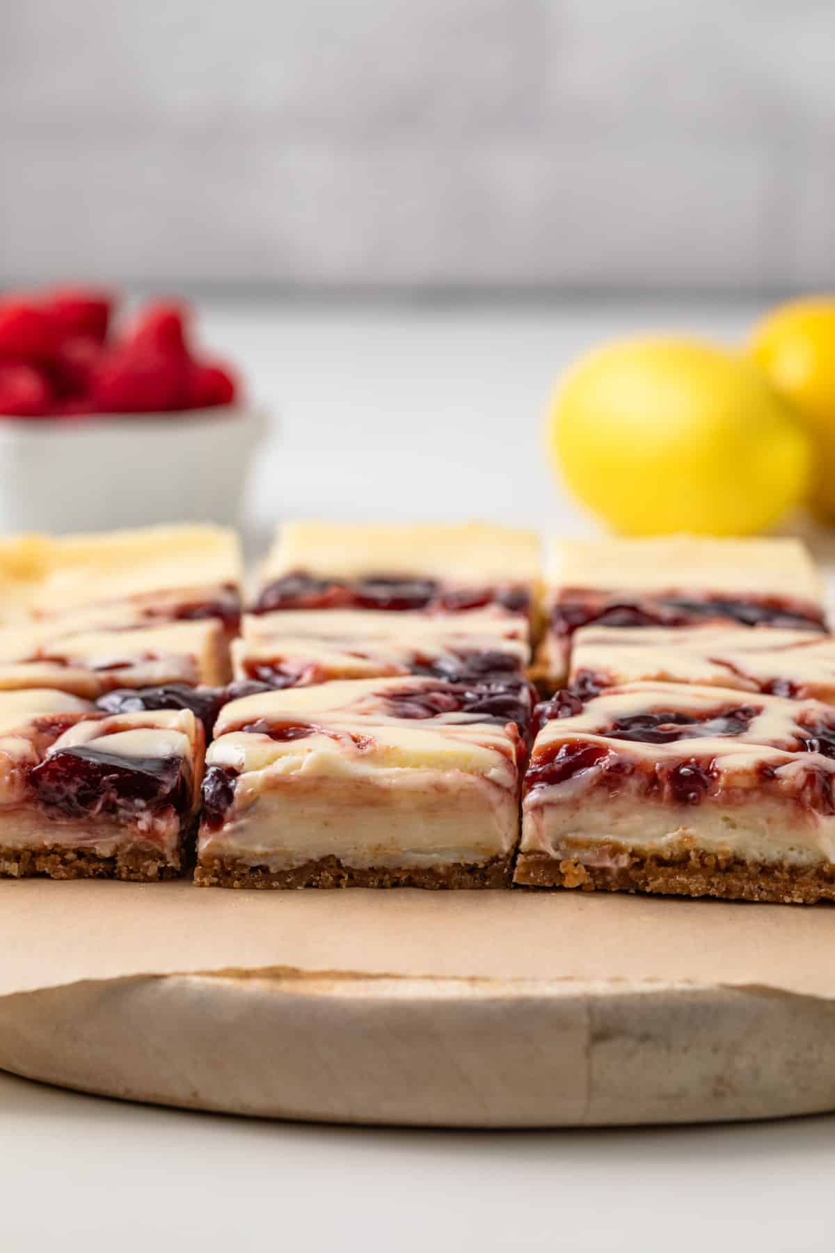 Side view of raspberry lemon cheesecake bars.