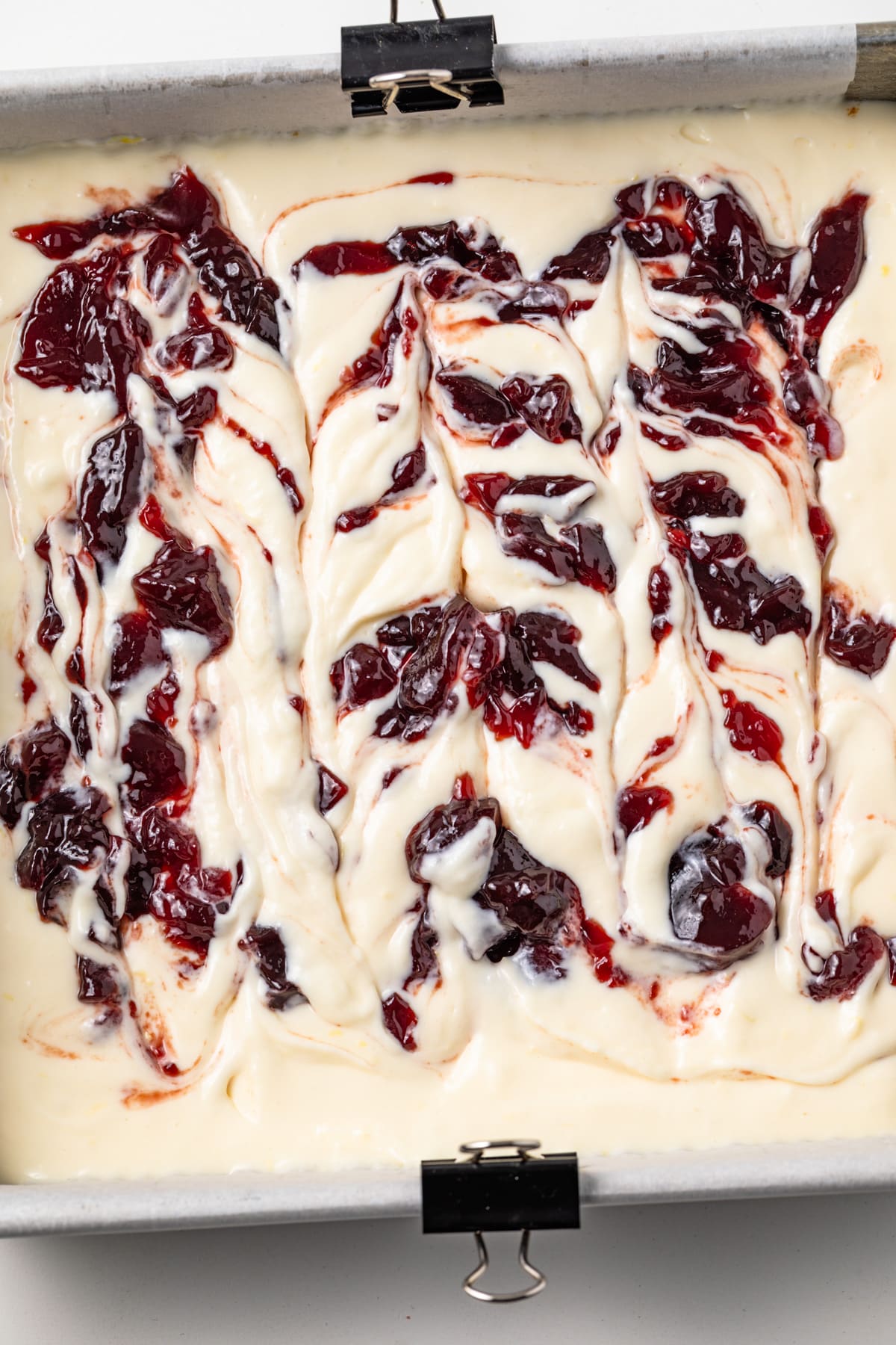 Raspberry jam swirled into lemon cheesecake filling.