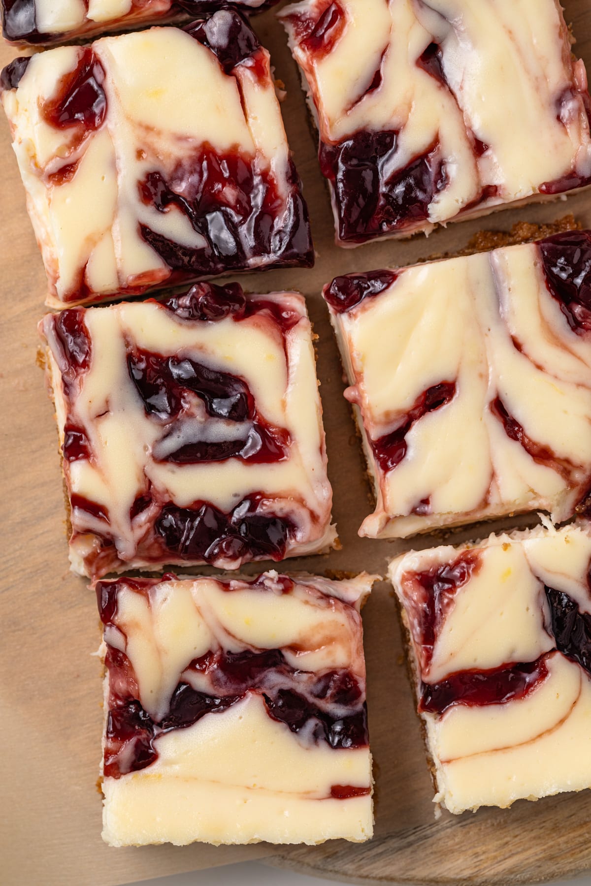Close up of raspberry lemon cheesecake bars.