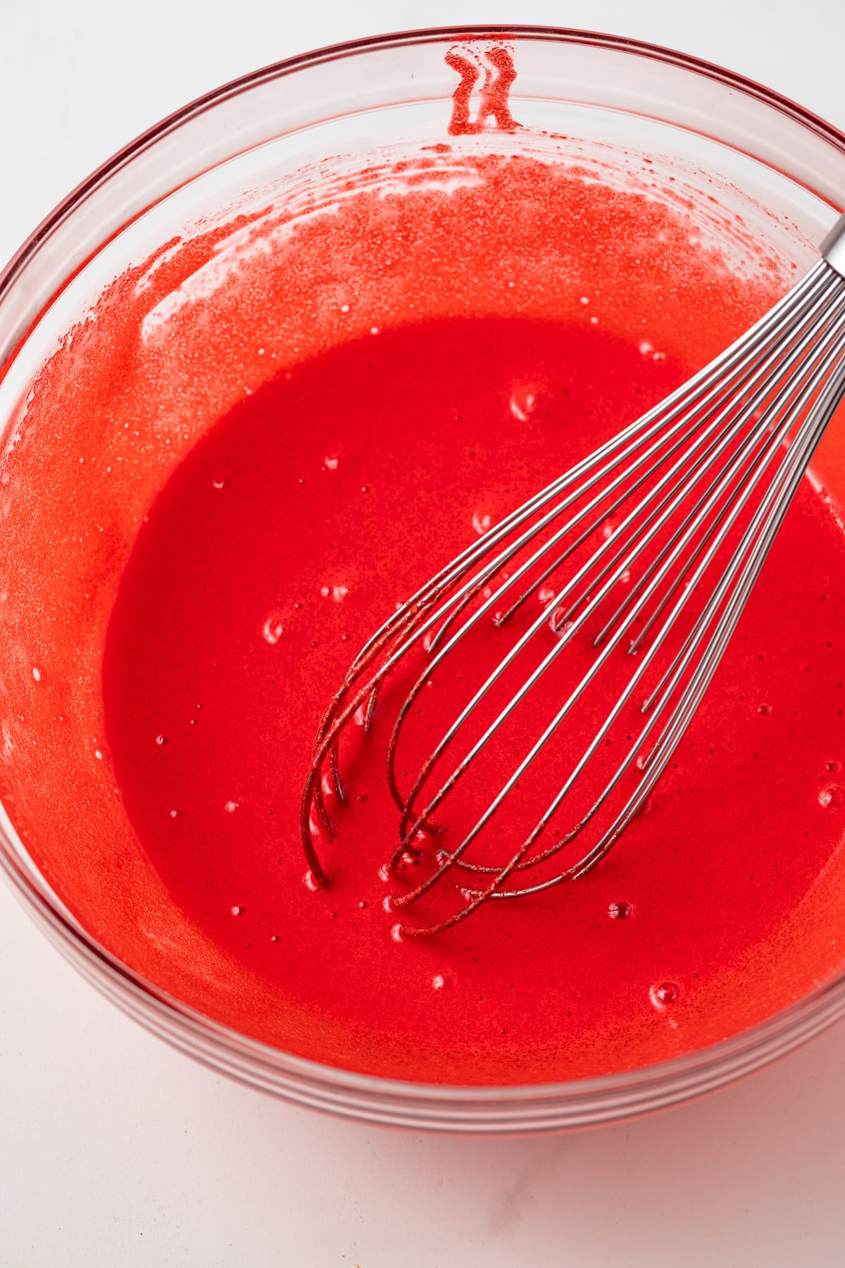 Red velvet mix in glass bowl.