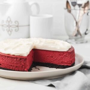 red velvet cheesecake with a slice taken out