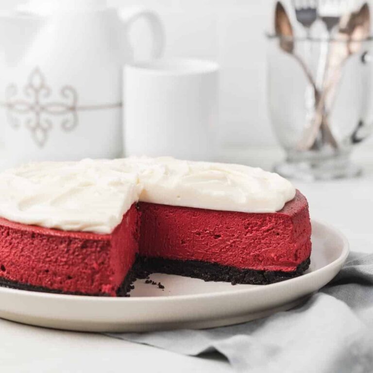 red velvet cheesecake with a slice taken out