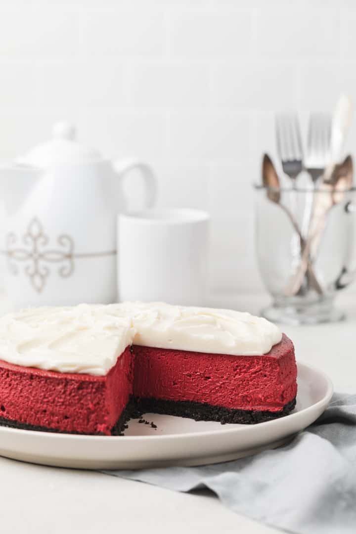 red velvet cheesecake with a slice taken out