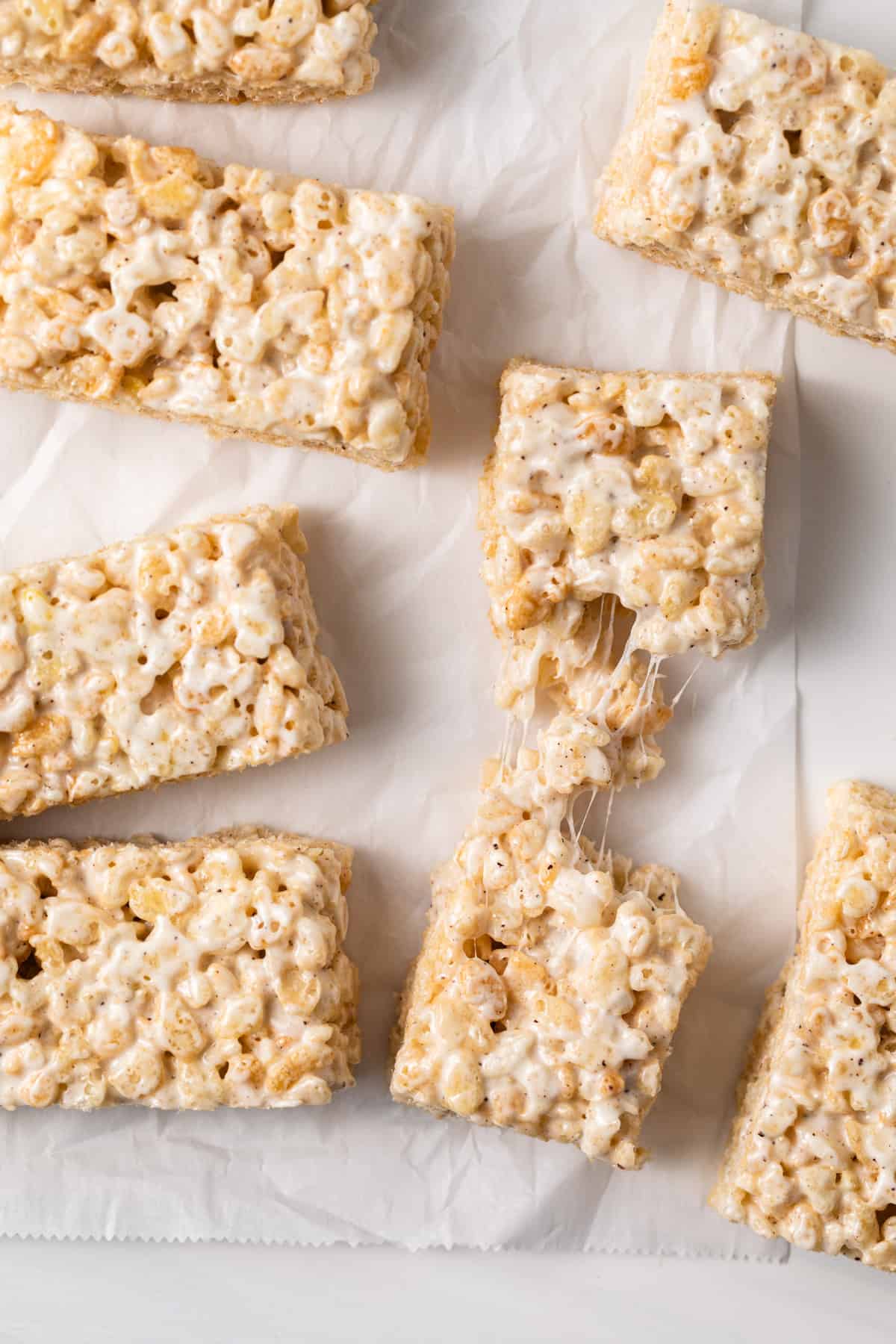 rice krispie treats with one pulled apart to show how gooey it is