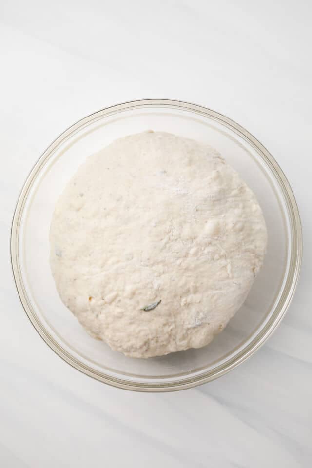 Shaped dough in glass bowl.