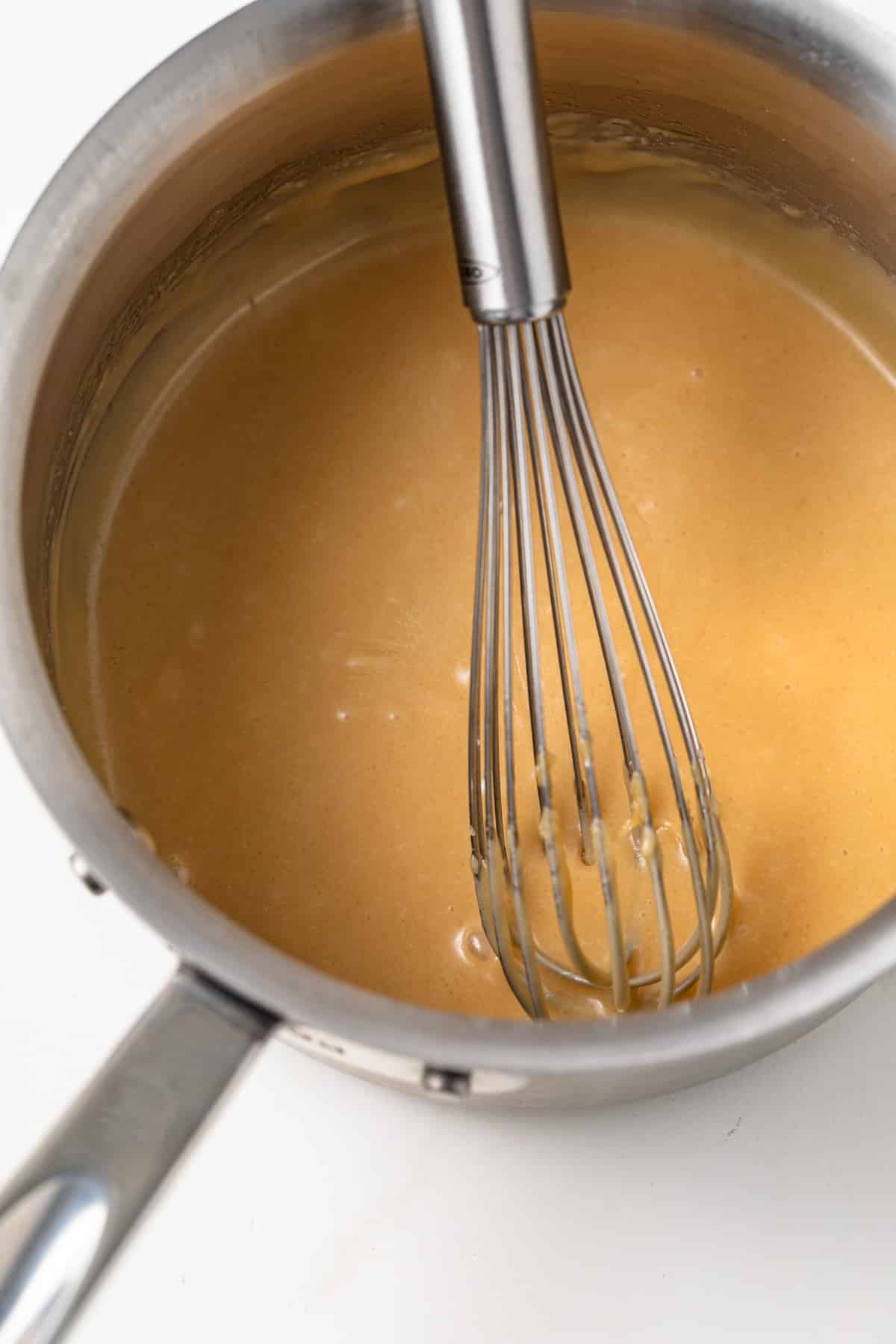 Salted caramel glaze in pot.